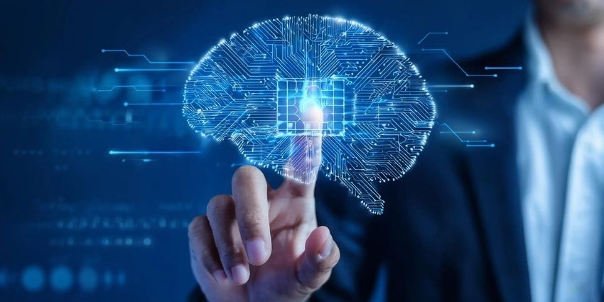 Male in suit touching a digital brain